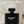 Men perfume with woody scent black bottle